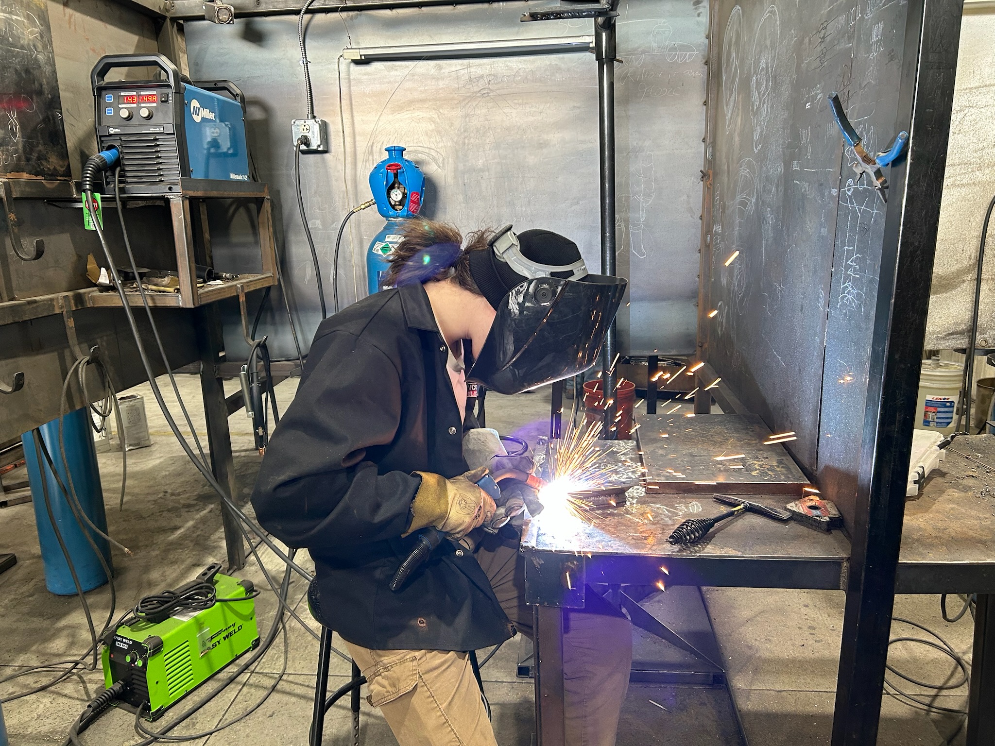 Student welding at 1848