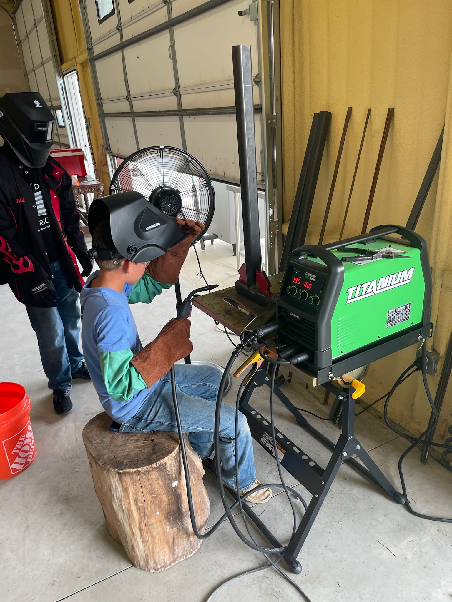 Youth learning to weld